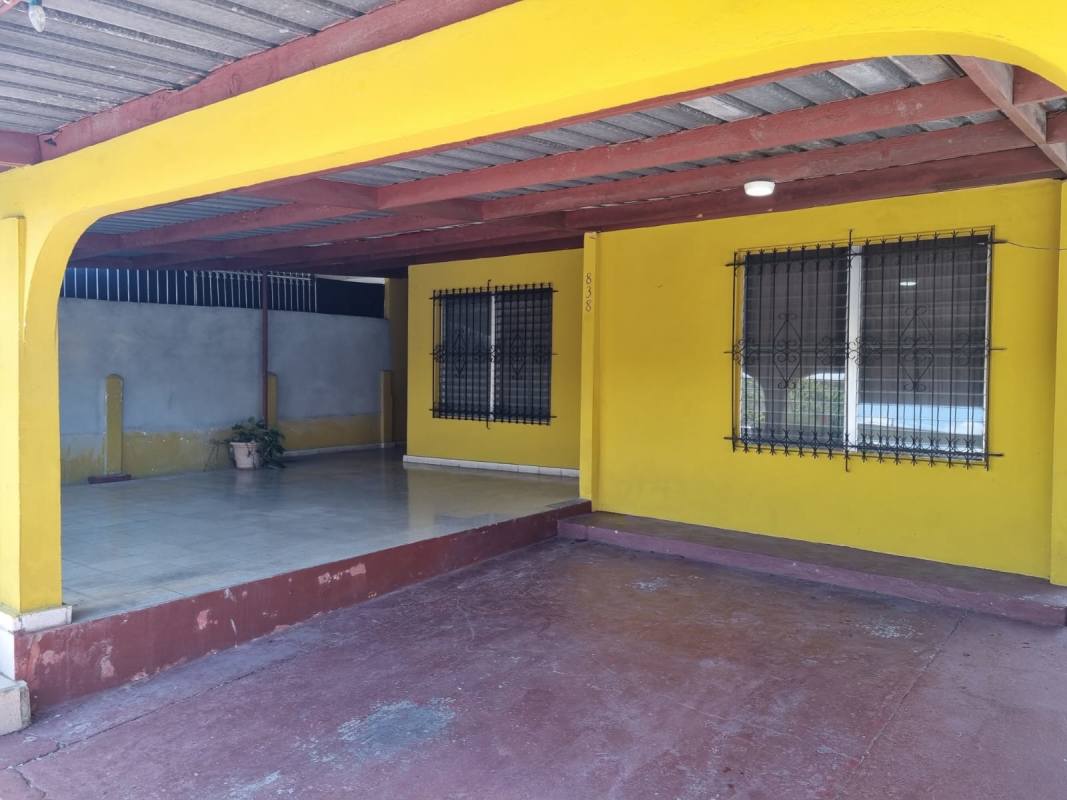 Interior living room with tiled floor and large window Panama suburban house