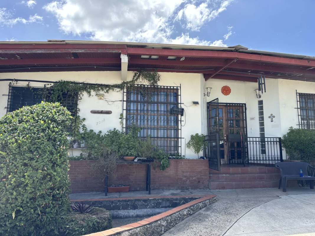 Traditional house with white facade, red roof, secure windows Las Cumbres Panama