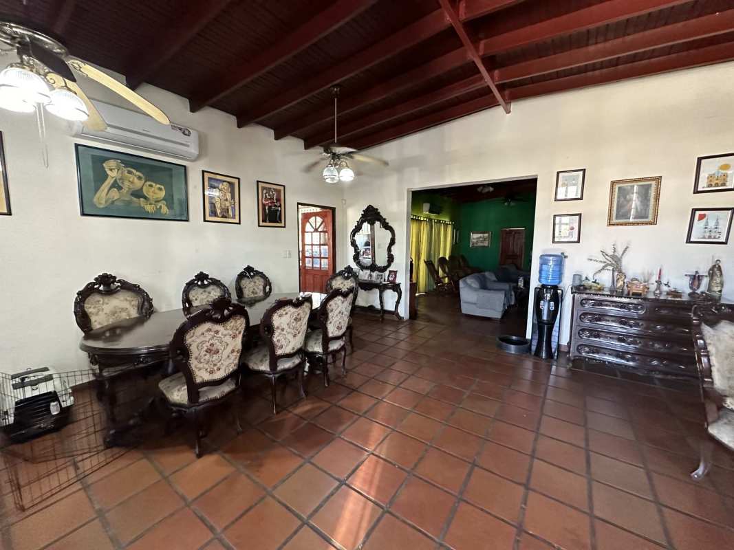 Traditional dining living space terracotta tiles ornate wood furniture Panama