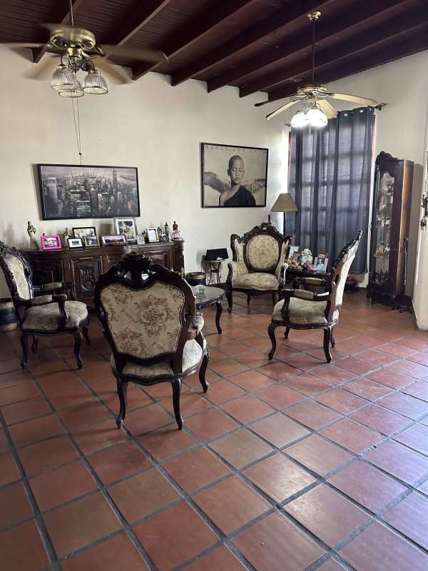 Living area with exposed beams, wooden furniture vintage style Las Cumbres Panama
