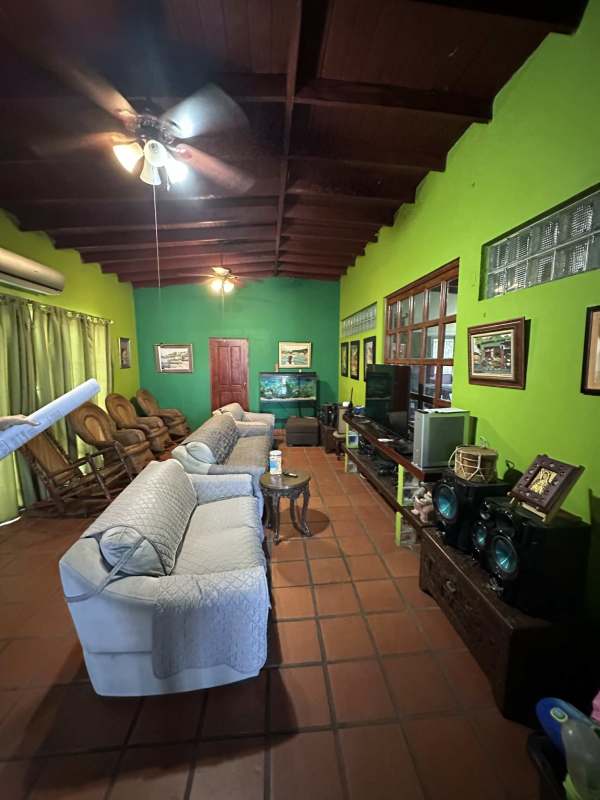 Interior living room with beamed ceiling, rustic decor in Las Cumbres Panama