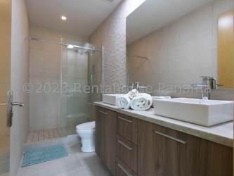 Designer bathroom with glass shower and double sinks at PH Playa Escondida Colon Panama