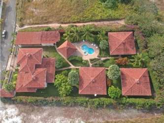 Aerial view of multi-villa estate with pool, tropical landscaping, close to Santa Clara Beach Panama