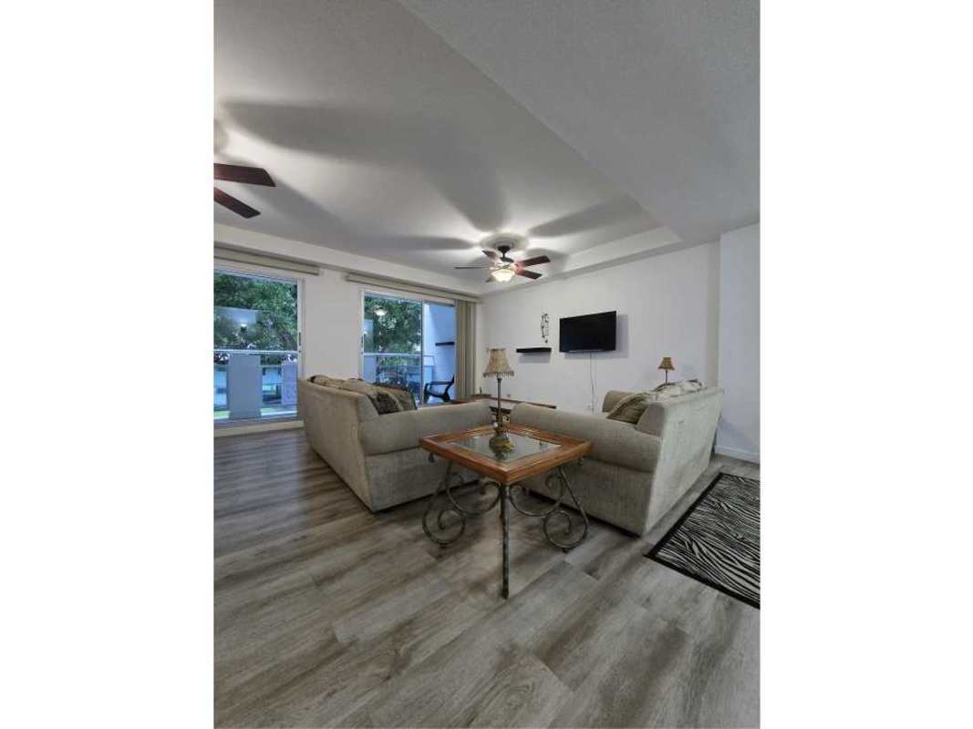 Large living room with ceiling fan, balcony access, modern decor PH Clayton Tower Clayton Panama
