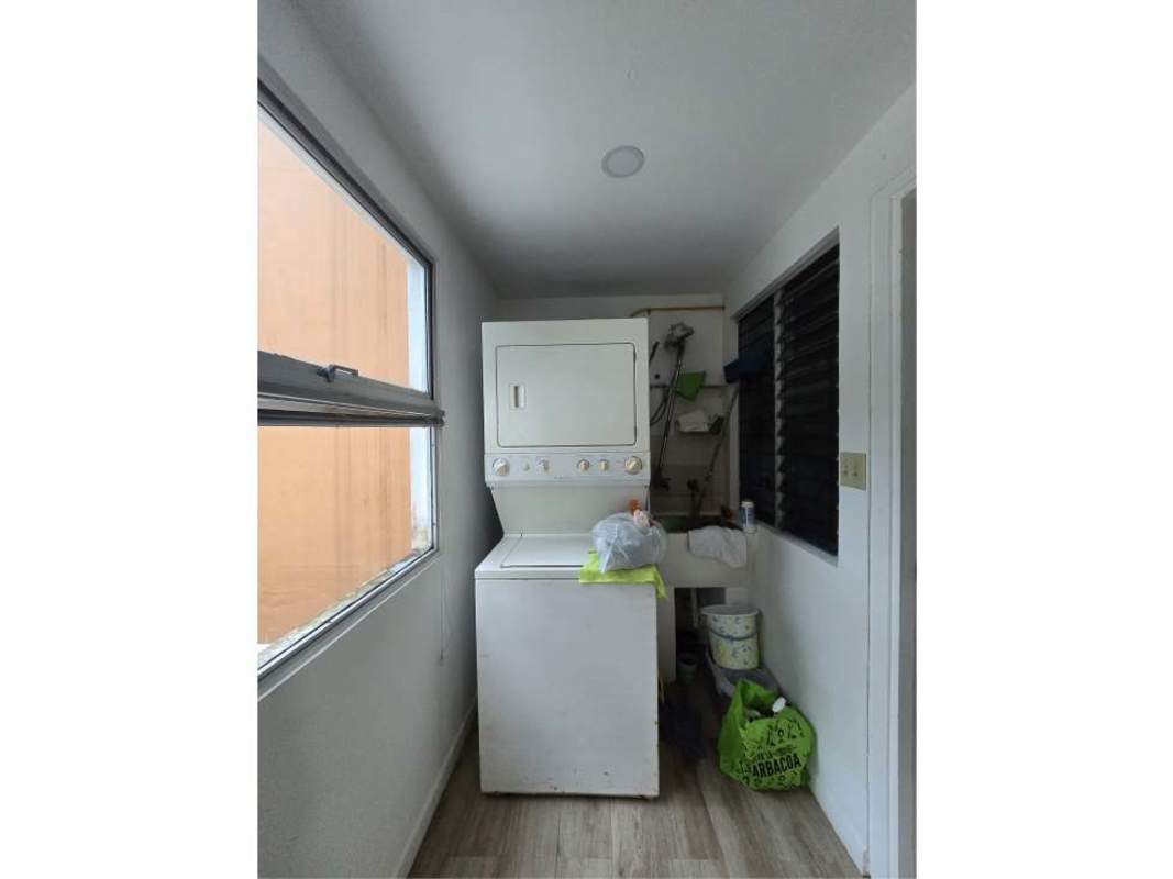 Laundry room stacked washer dryer window sink PH Clayton Tower Clayton Panama