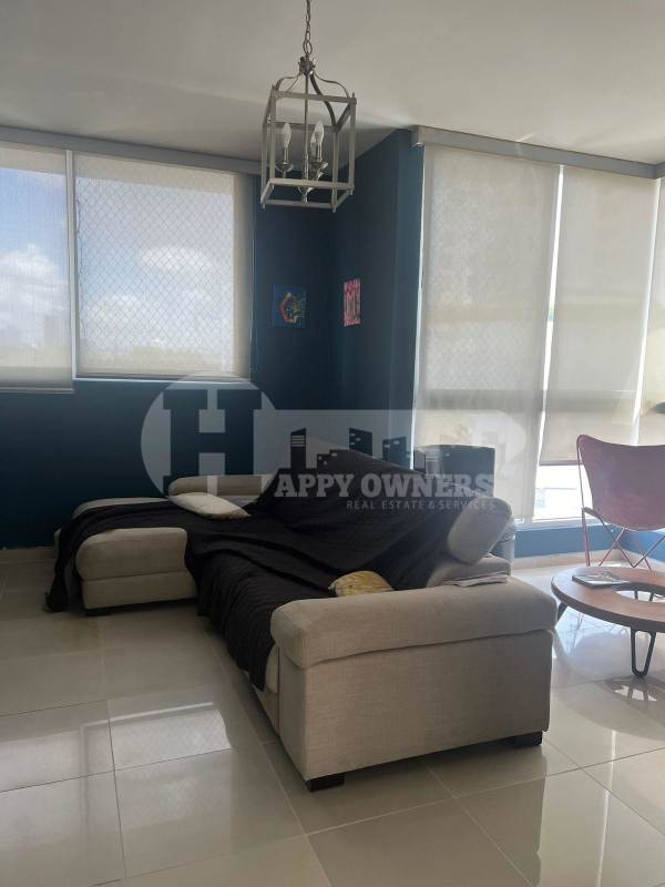 Bright living room with floor-to-ceiling windows and panoramic views PH Vision Tower Panama
