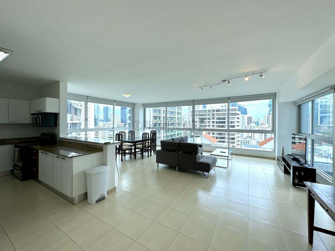 Spacious living dining room with floor-to-ceiling windows and ocean view at GrandBay Tower Panama City