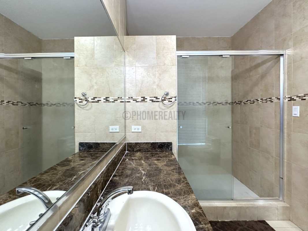 Infinity rooftop pool and lounge area with Pacific Ocean and skyline views at GrandBay Tower Panama