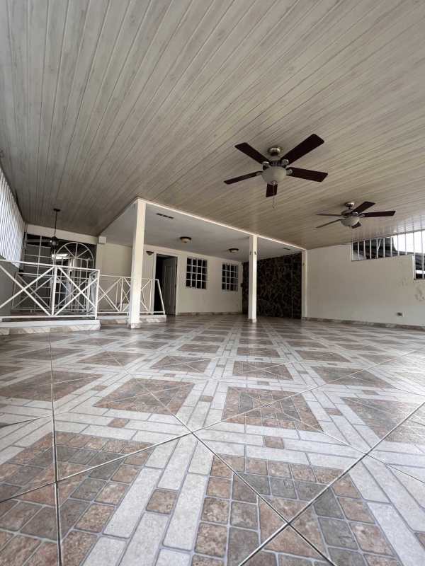 Exterior front with double garage doors secure home Villa Cáceres El Dorado Panama