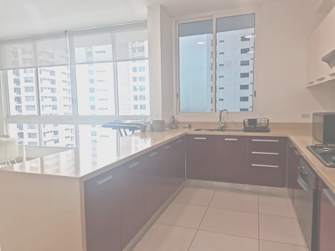 L shaped kitchen with modern cabinets large city window PH Castellamare apartment Panama
