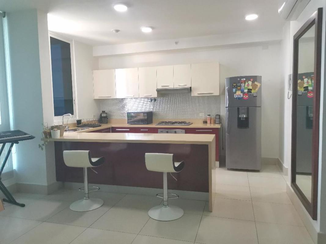 Kitchen area with island seating stainless appliances modern finishes PH Castellamare