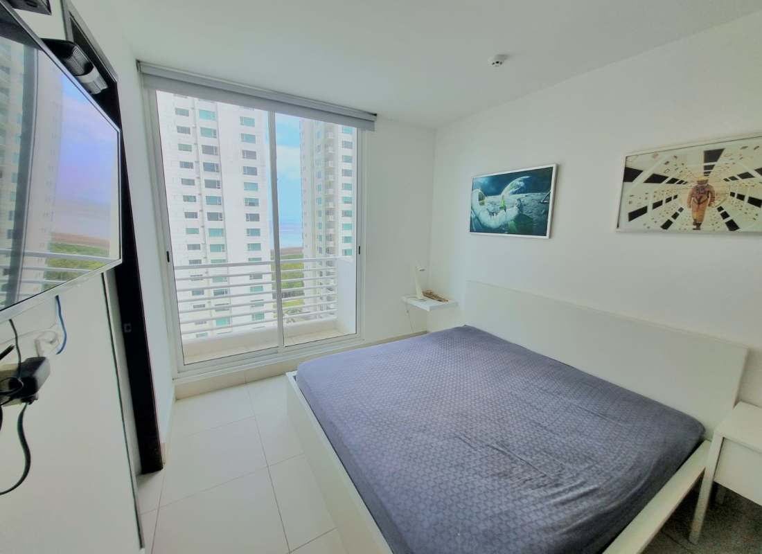 Bedroom with glass doors cityscape and sea views balcony PH Castellamare Panama