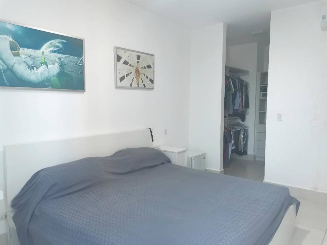 Spacious minimalist bedroom walk-in closet porcelain floors PH Castellamare apartment Panama