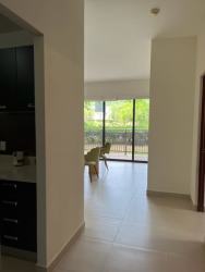 Bedroom with AC, natural light, large window access to balcony in Panama Pacifico apartment