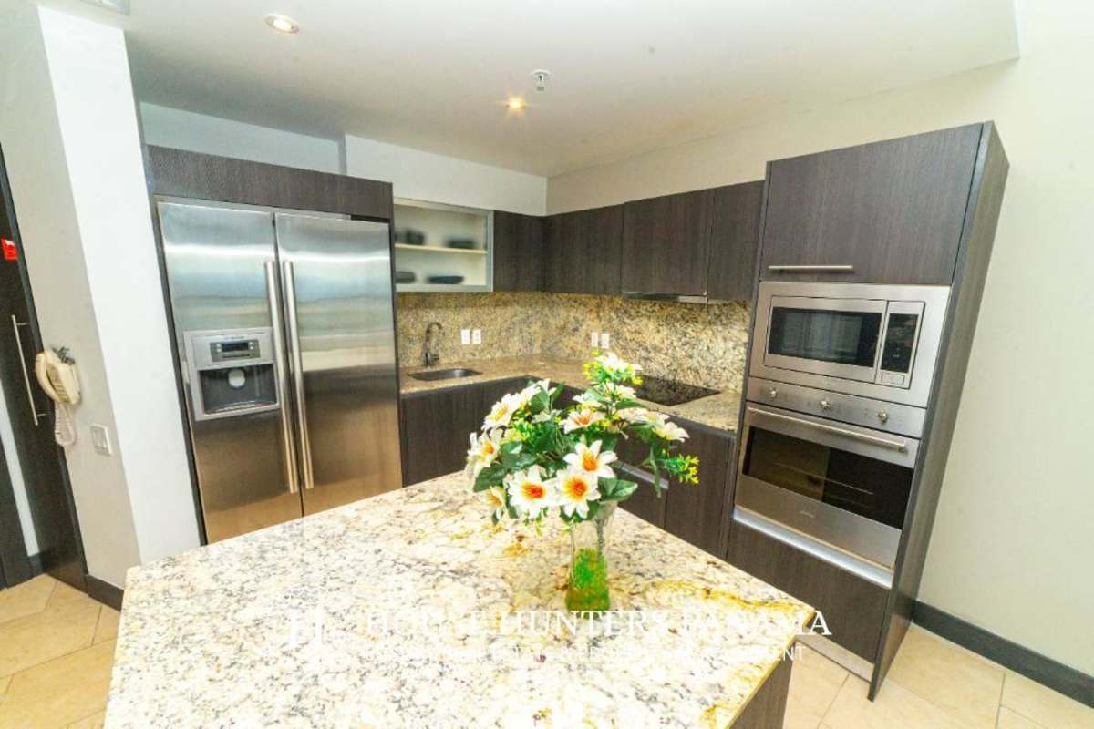 Modern kitchen granite countertops stainless appliances The Ocean Club Punta Pacifica Panama