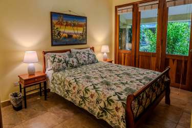 Living room with large windows, ocean views, tile flooring in Costa Esmeralda villa Panama