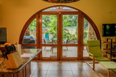 Spacious open kitchen with granite countertops, wood cabinets, ocean villa Costa Esmeralda Panama