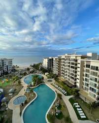 Multiple swimming pools and lush landscaping at Playa Caracol condos in Punta Chame