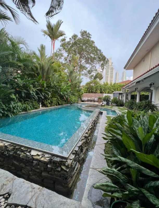 Tropical backyard pool with jacuzzi, lush landscaping in PH Costa Serena Panama City