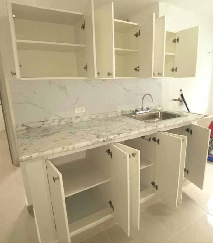 Open roomy living-dining space with view of remodeled kitchen Complejo La Felicidad Panama