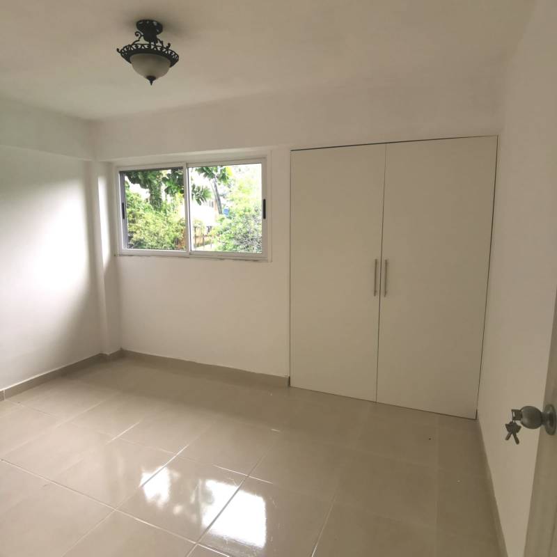 Spacious bedroom with tile floors, built-in closet, large window La Felicidad La Locería Panama