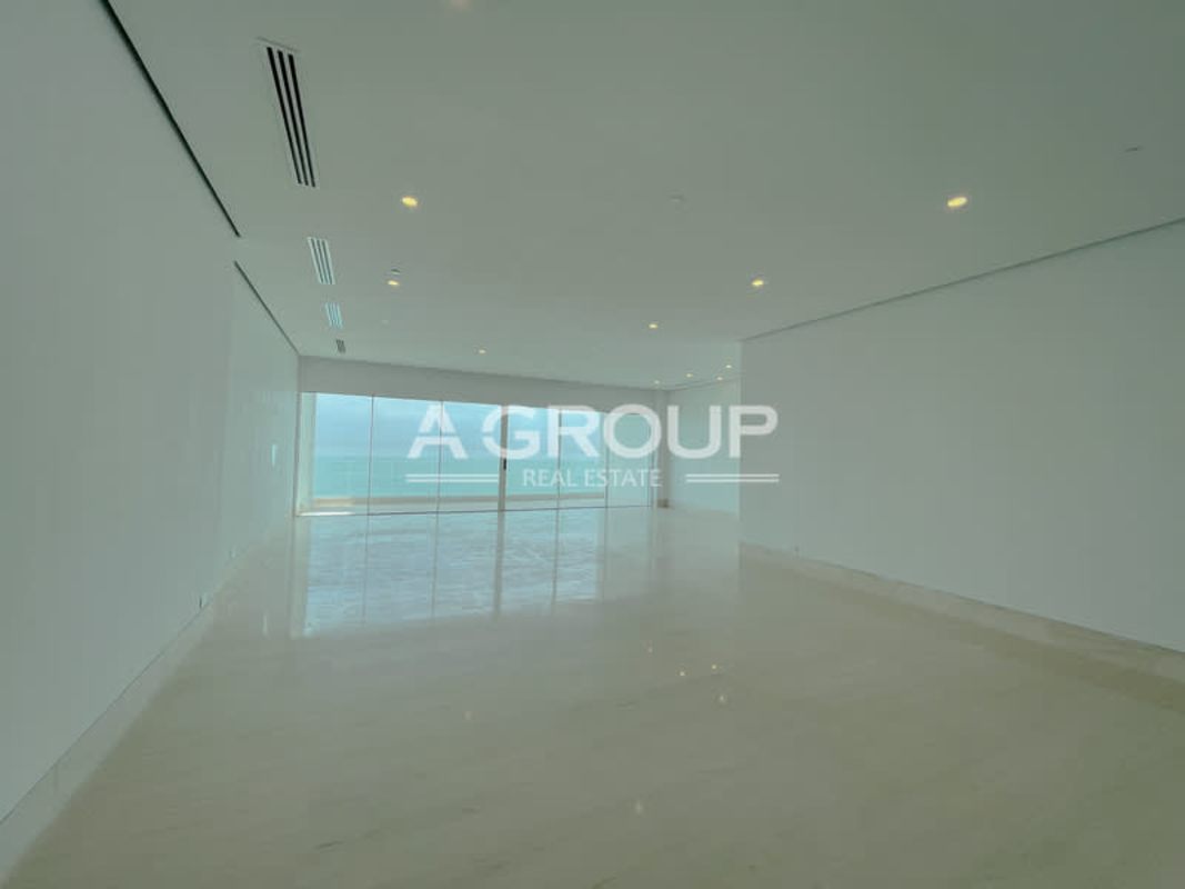 Spacious modern living room with marble floors and expansive Pacific Ocean views in Ocean Pearl, Panama City