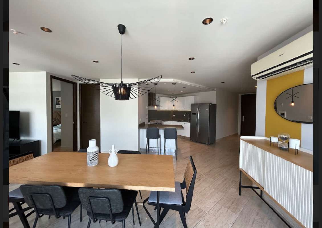 Open plan kitchen dining living furnished area PH Regent Costa del Este Panama City