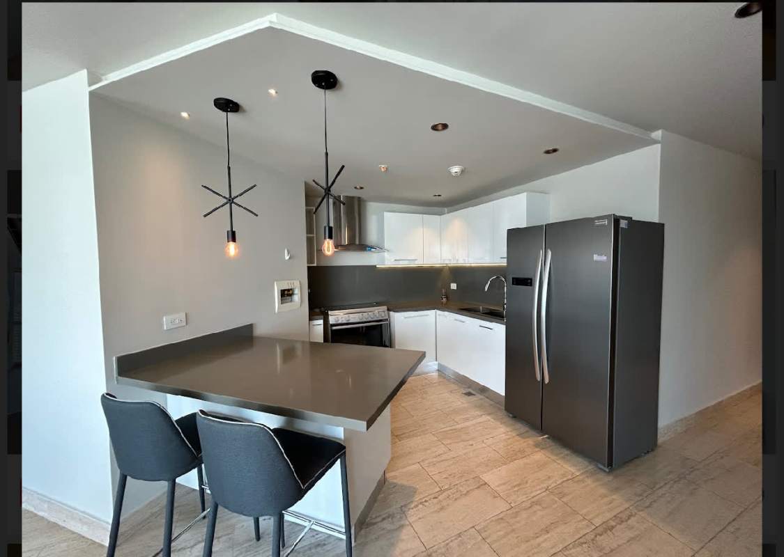 Bedroom with geometric wall design and city skyline view PH Regent Costa del Este Panama