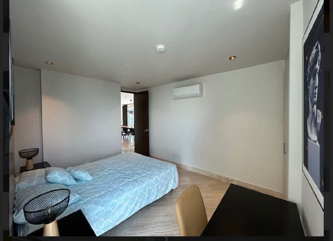 Bright living room with floor-to-ceiling windows city skyline view in PH Regent Costa del Este Panama