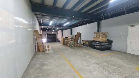 Open high ceiling interior of warehouse at Colón Free Zone Panama commercial realty