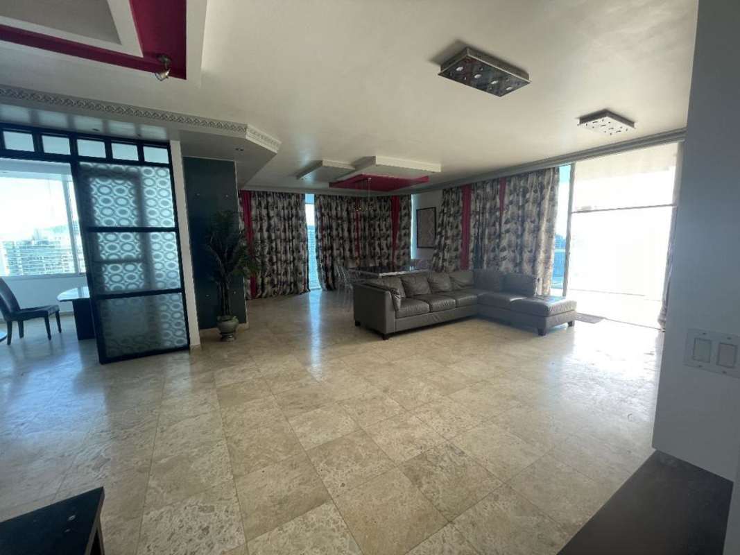 Spacious master bedroom with floor-to-ceiling oceanview windows in PH BICSA Tower Panama City