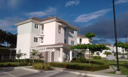Open living dining space leading to terrace with golf views in Bijao Gatun 22 Panama
