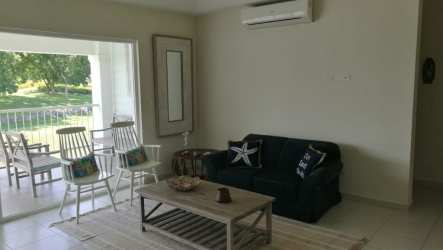 Exterior street and buildings in Bijao Gatun 22 gated beach golf community Panama