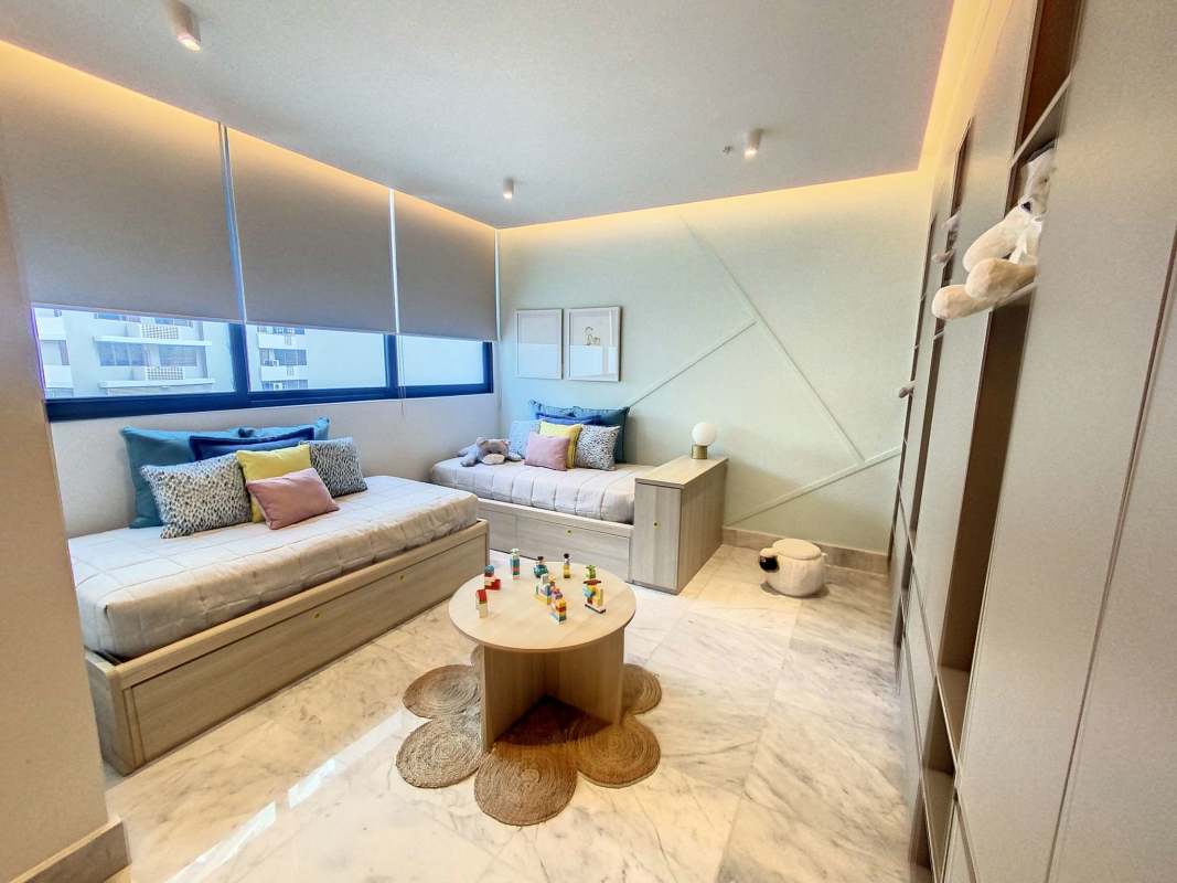 Luxury master bedroom with floor-to-ceiling windows and balcony ocean views Punta Paitilla Panama