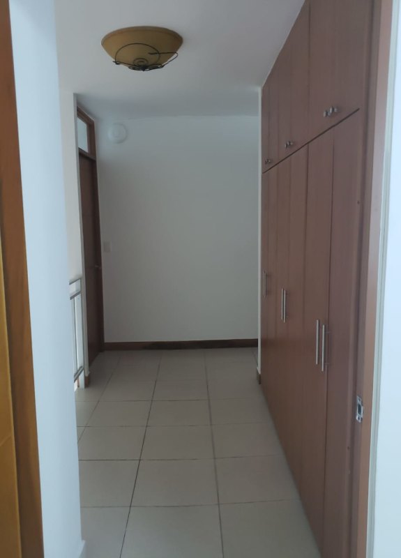 Bedroom with built-in closets floating shelves tiled floor PH Mont Royale El Cangrejo Panama