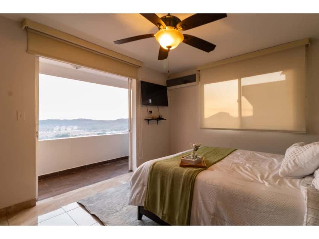 Spacious modern bedroom with large windows, balcony, ceiling fan, AC in Limajos Tumba Muerto house