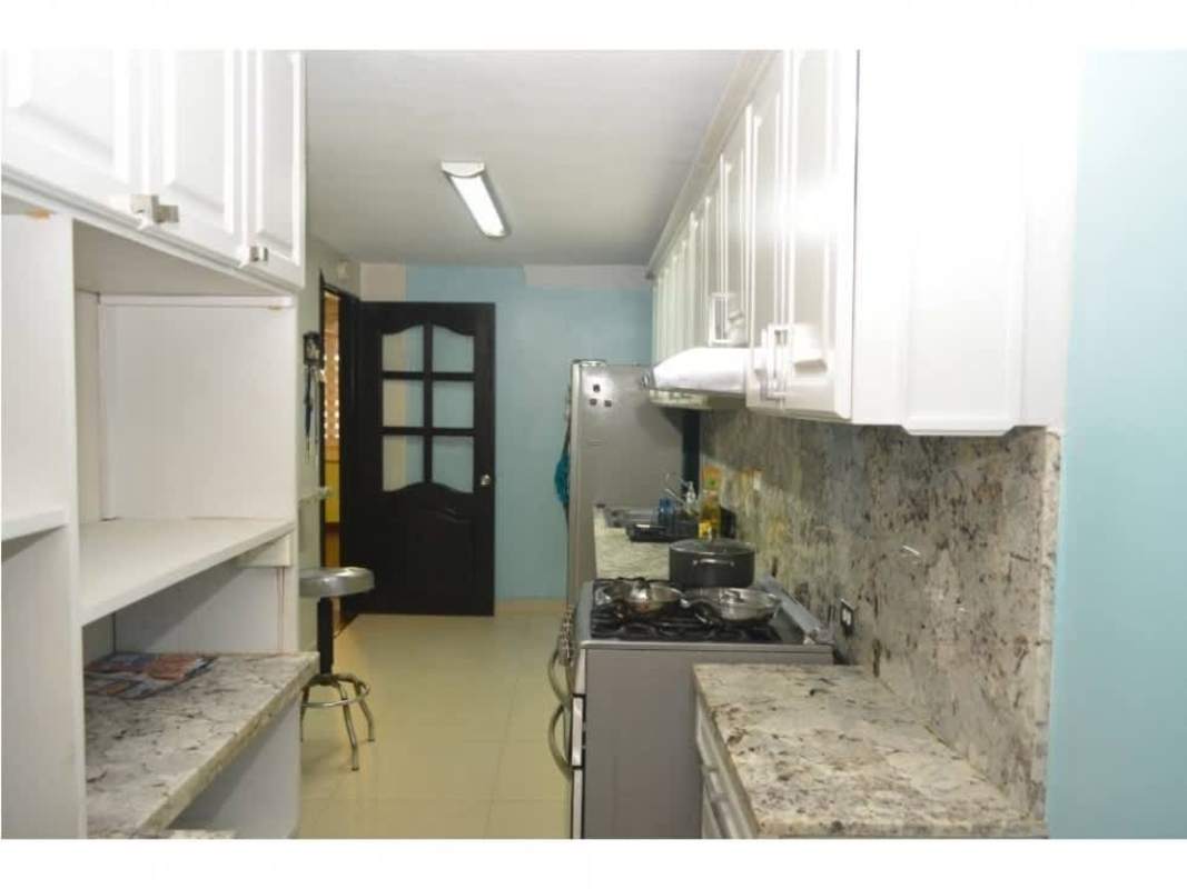 Bathroom with vessel sink large mirror walk-in shower in Condado del Rey duplex house Panama City