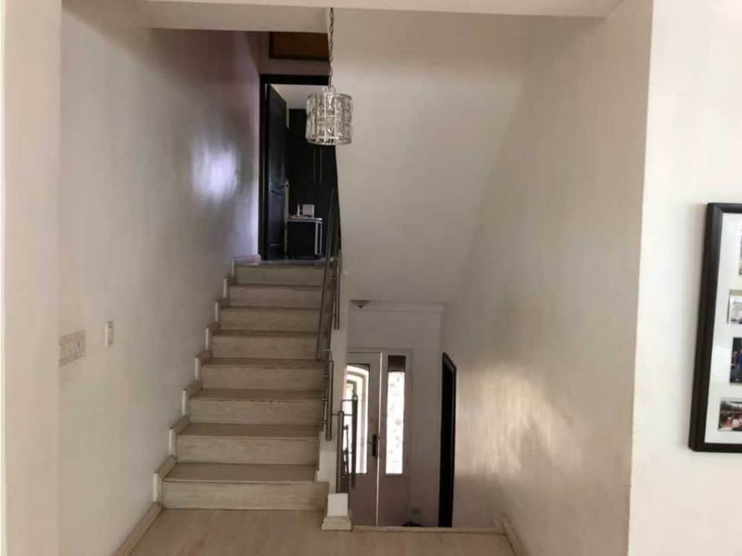 Open kitchen overlooking dining room with modern features in duplex house Betania Panama