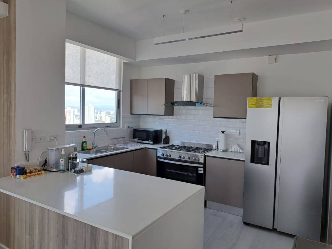 Master bedroom ensuite bath furnished apartment PH Urbana Obarrio Panama skyline view