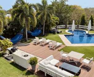Private swimming pool and sun deck at beach villa in Punta Barco Resort Panama