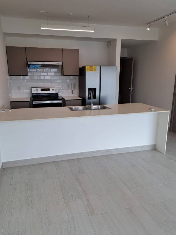 Modern entrance hallway with tile floors, wood doors and lighting PH Urbana Panama City