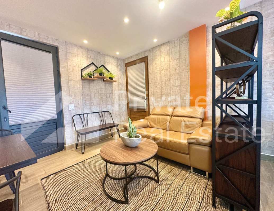 Modern kitchenette with patterned backsplash, sleek appliances studio apartment Casco Viejo Panama