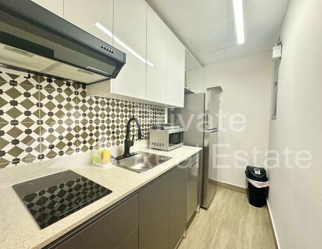 Spacious rooftop terrace with lounge seating, pergola, ocean and skyline views Casco Viejo Panama