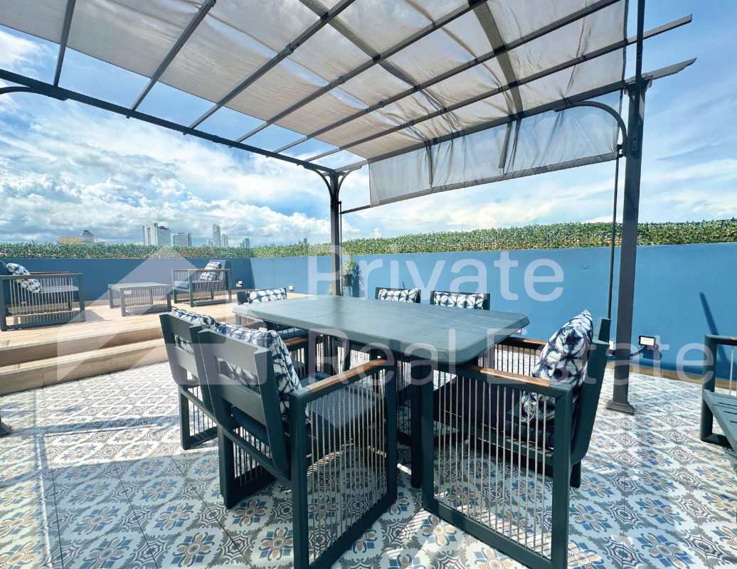 Sleek bathroom with glass enclosed shower, patterned tile, wall-mounted vanity Casco Viejo Panama