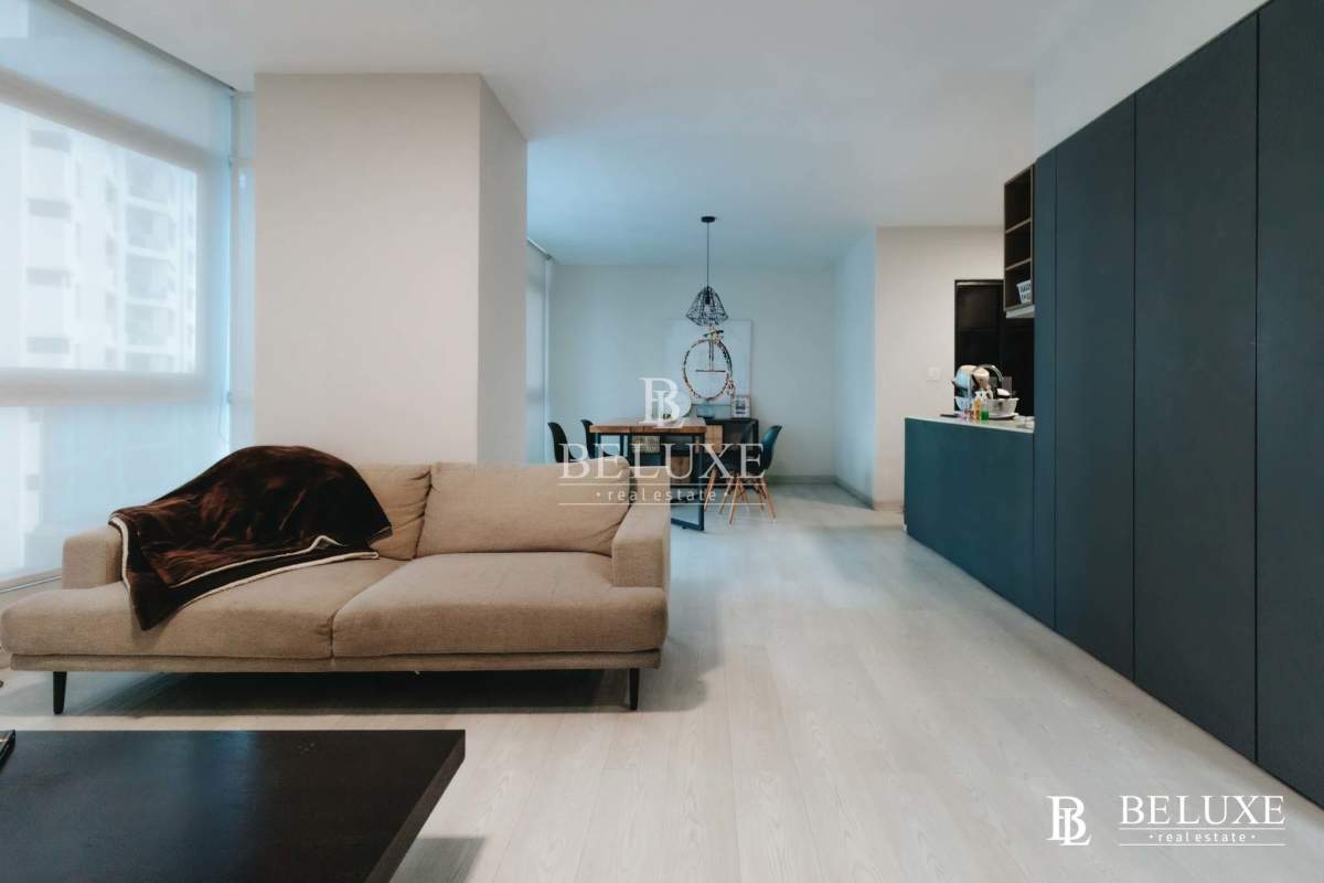 Modern living dining area with floor-to-ceiling windows and ocean view in PH Bayfront Tower Panama City