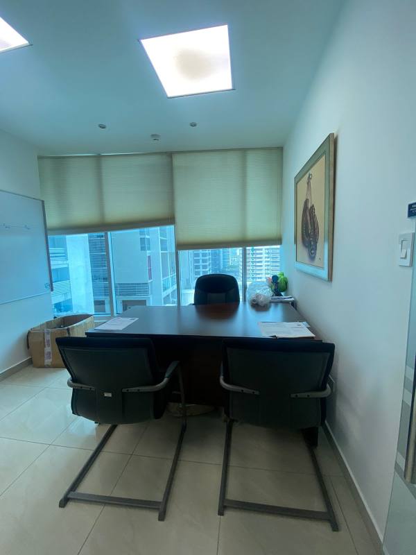 Executive office space with large windows, three chairs, desk, blinds in PH Banesco Tower Panama City