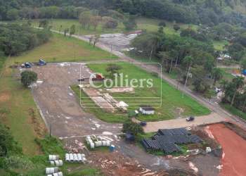 Large cleared land with construction underway near port of Panama and Rodman metro