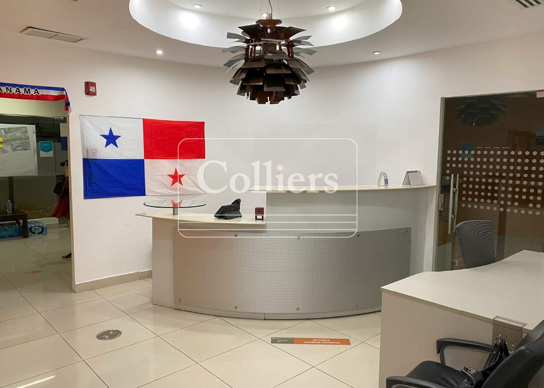 Reception lobby area with curved desk and Panama flag at Torre de las Américas Panama City