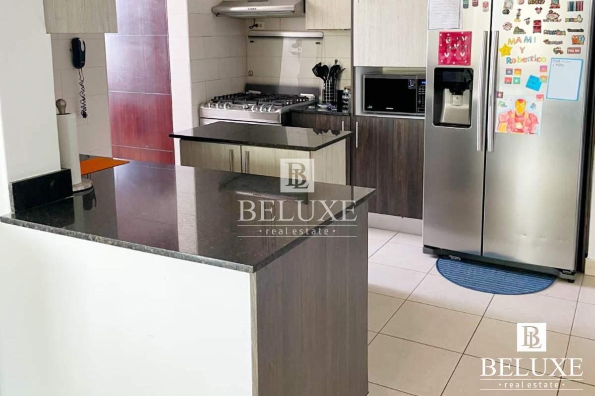 Child's bedroom with colorful bedding, large window and wall shelves near city center PH Concept San Francisco Panama