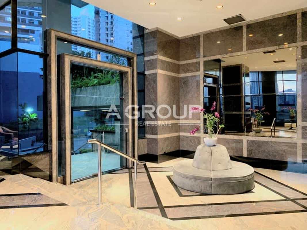 Elegant lobby with marble floors, glass windows, modern furnishings at Villa Marina Panama City